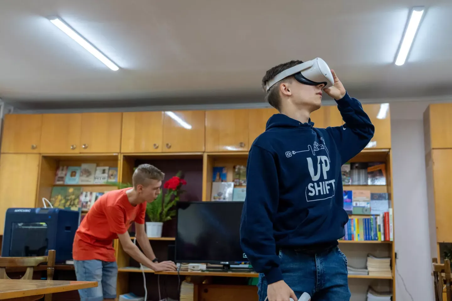 Vitalii, an 18-year-old college student and Upgrade team member from Ternopil in VR glasses.