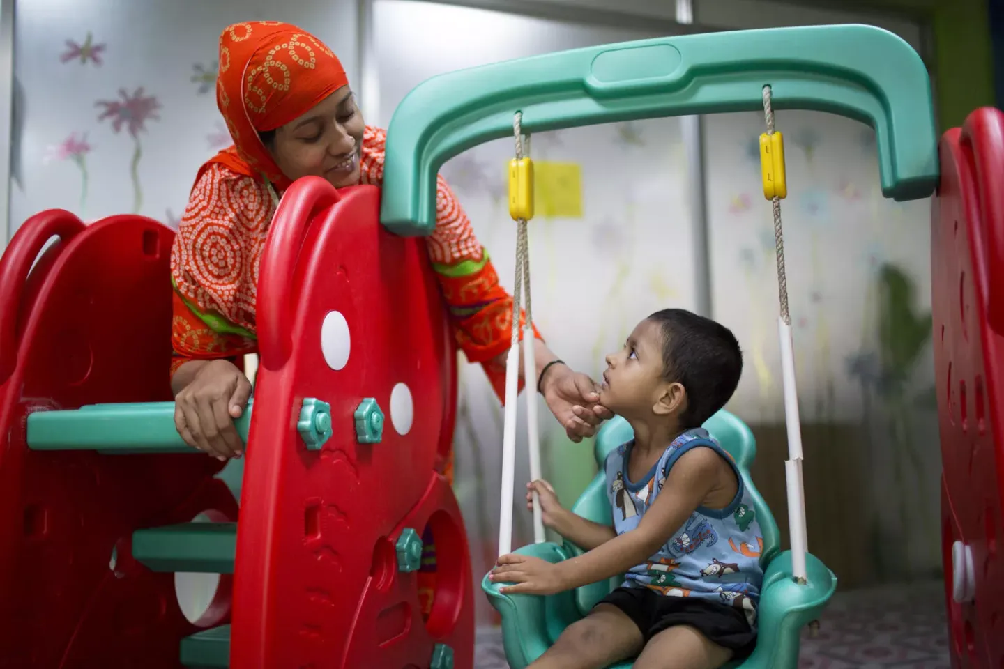 Mother and child in a playground.