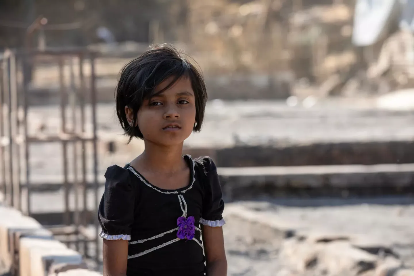 A girl posing for camera.