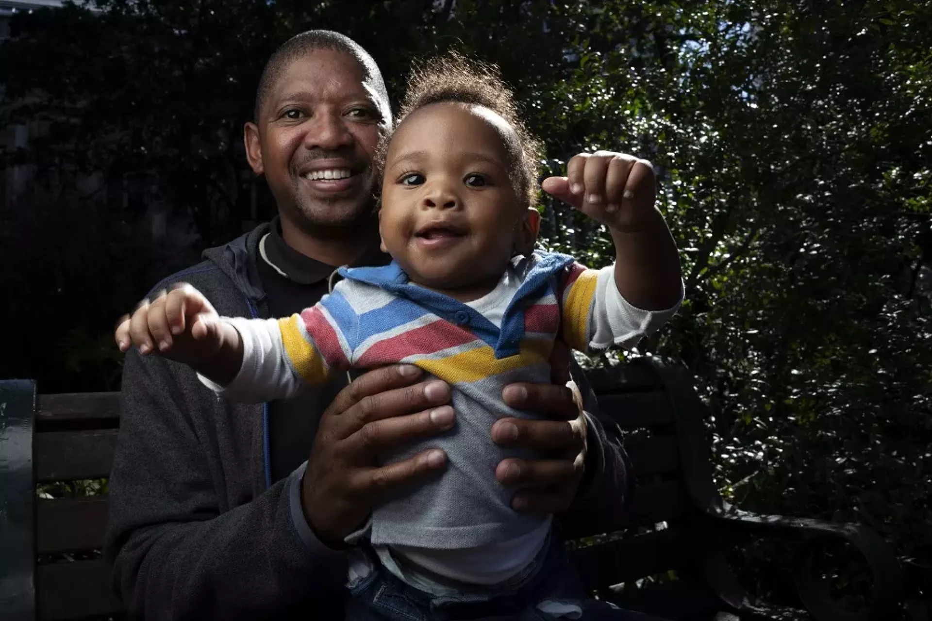 A father holding his child.